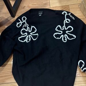 Aveda Black Sweater with White Floral Design